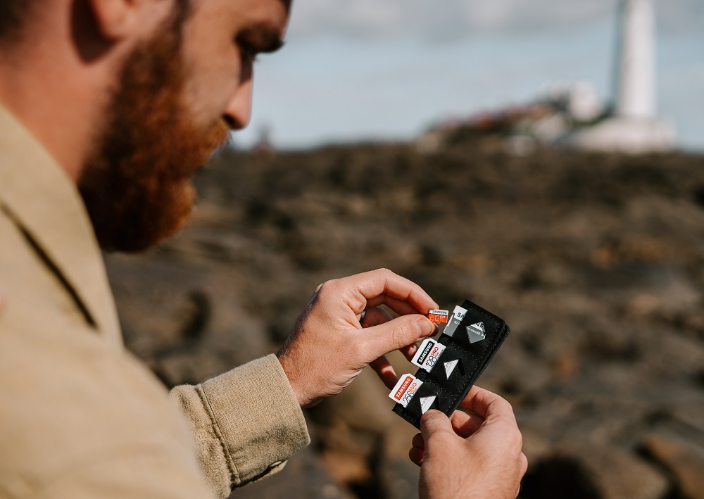 Man holding SD cards
